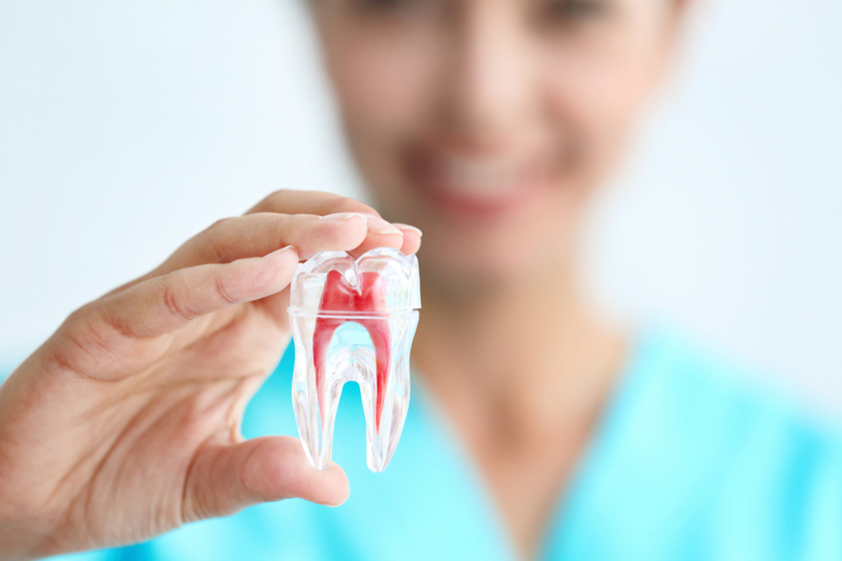 what are the symptoms aand procedure for root canal treatment